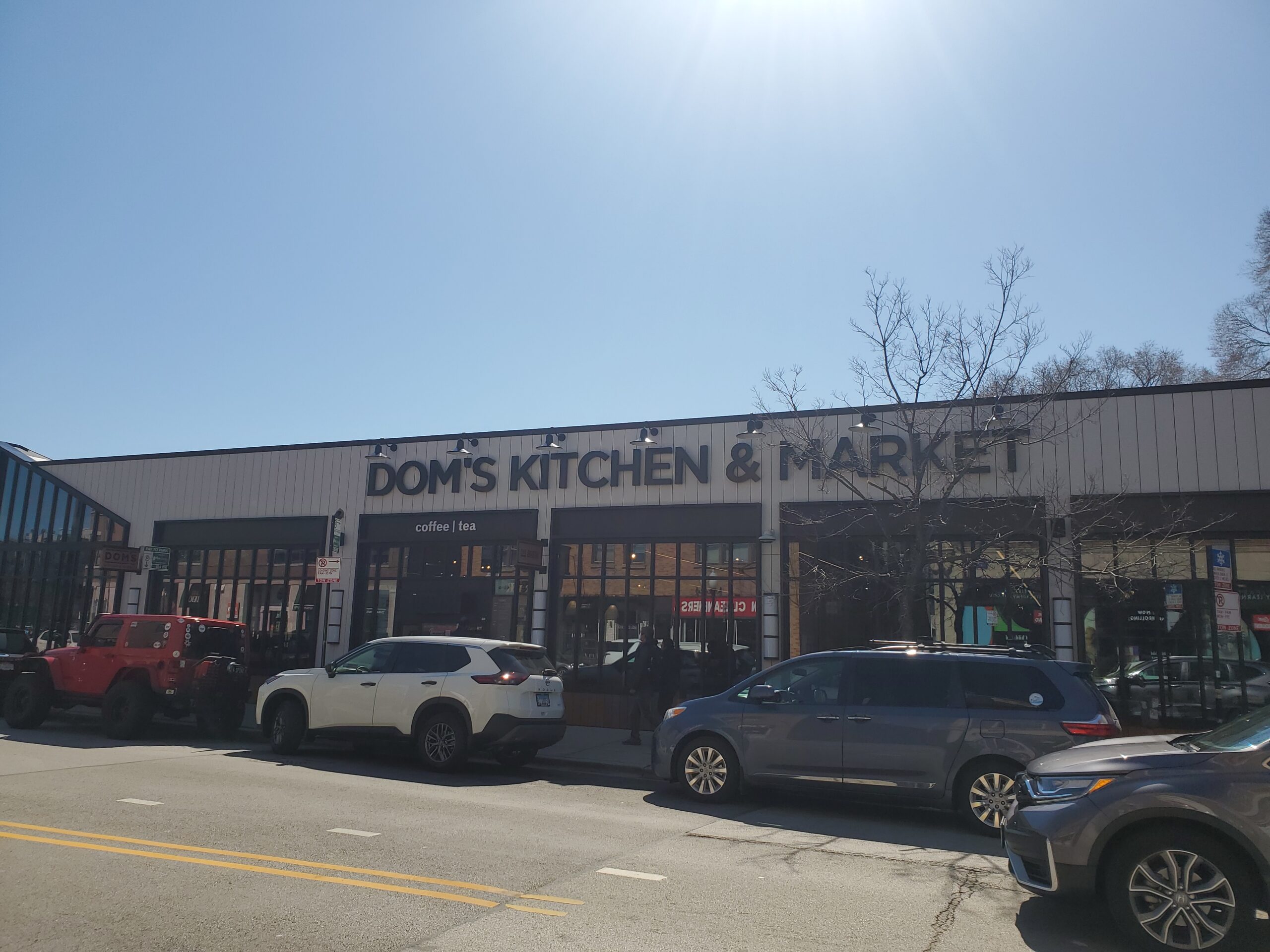 back of Dom's Market and Kitchen with street parking