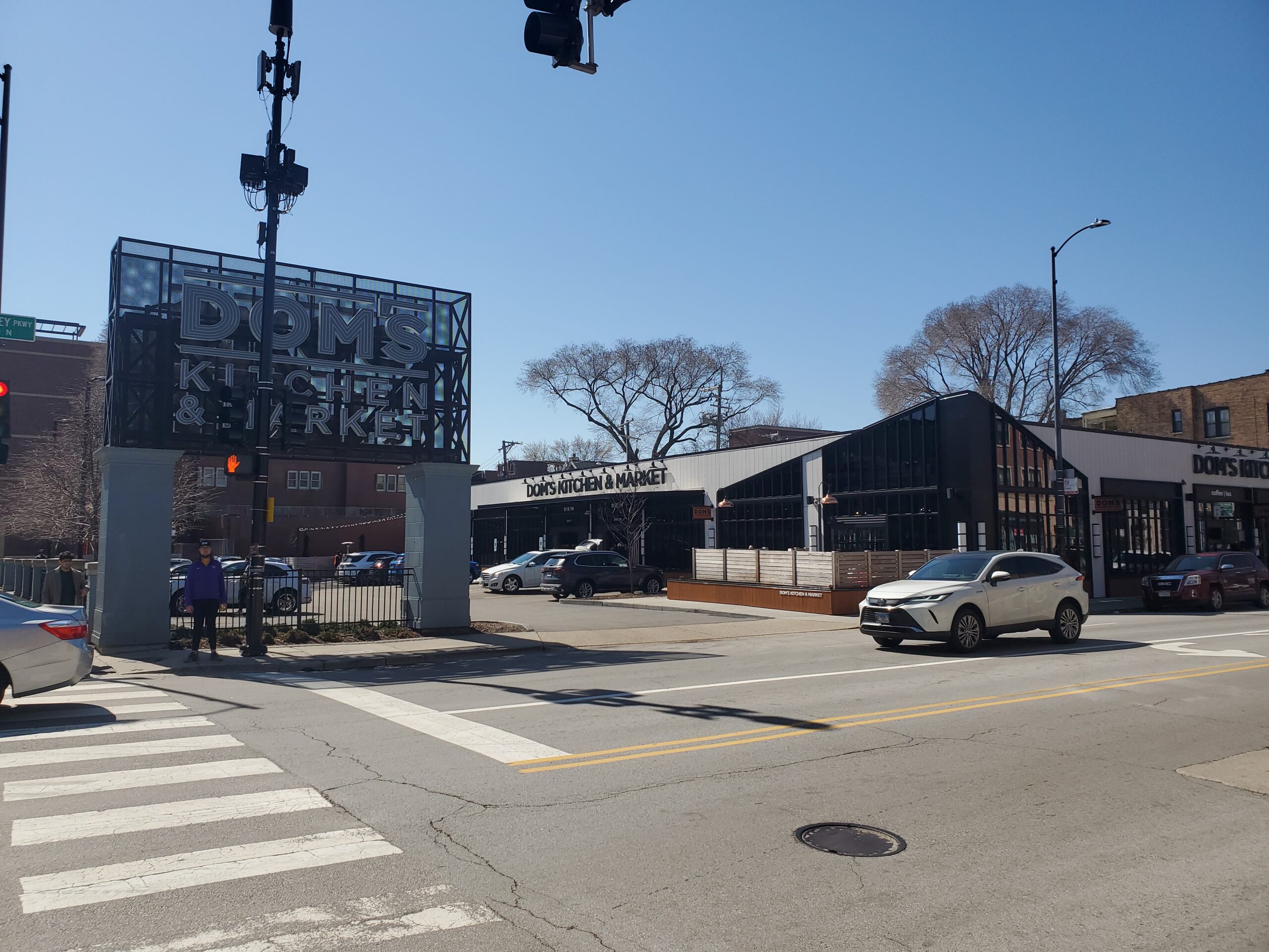 Dom's Kitchen and Market viewed from the intersection where it's entrance is located