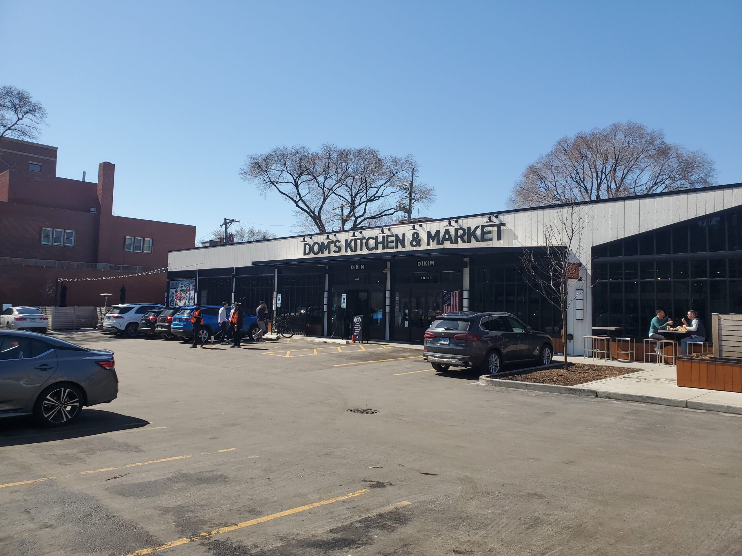 dom's kitchen and market parking lot with proper grading and stormwater drainage and looking towards the front door