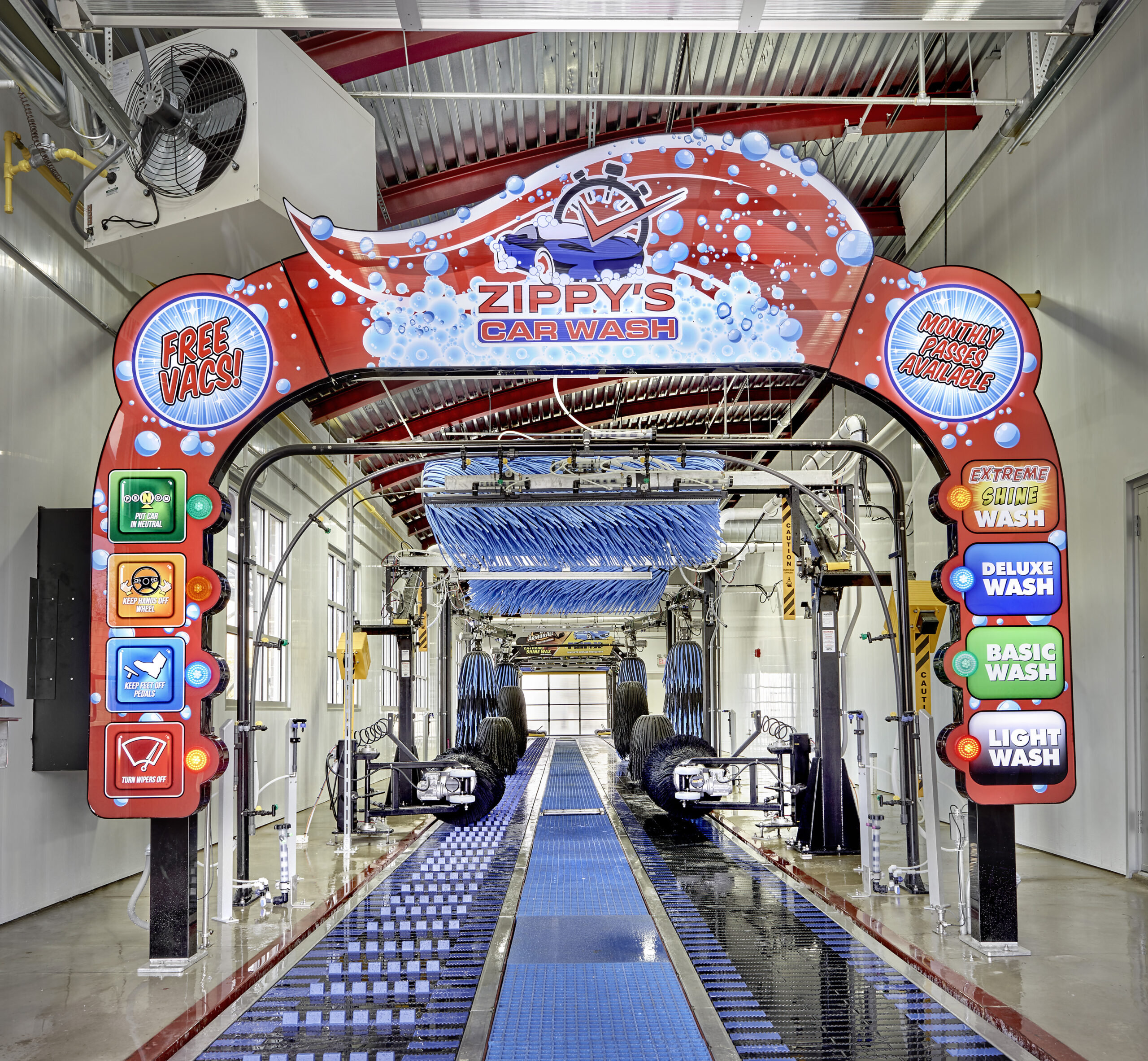 interior of Zippy's car wash with bright lights and moving brushes